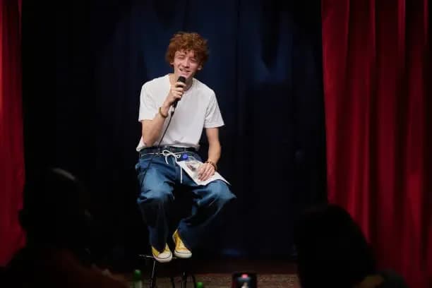comedian sitting